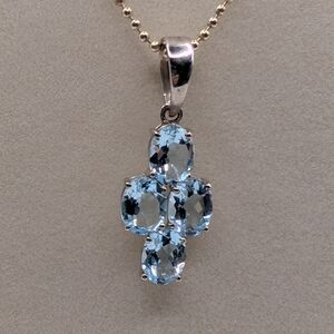 Blue Topaz And Silver Cross Necklace